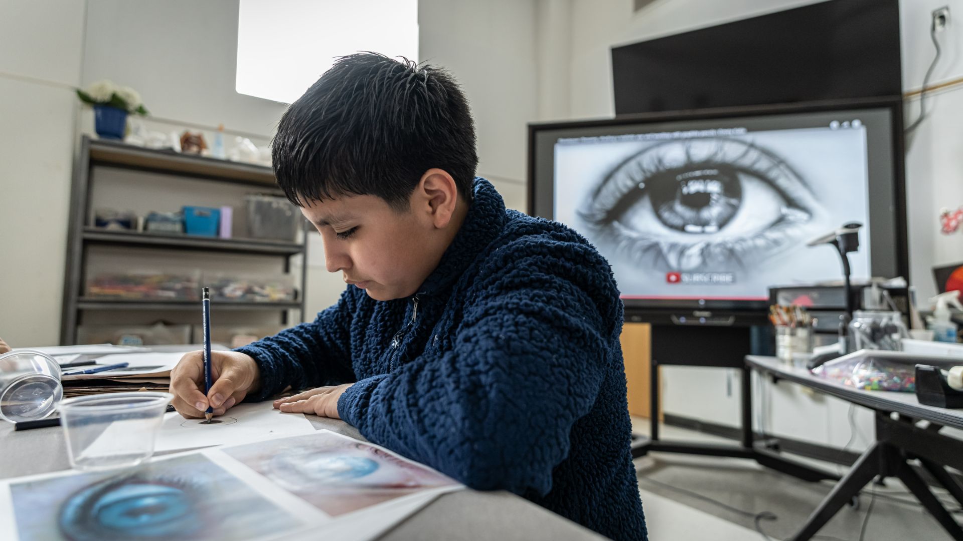 Student at Saint John the Baptist Middle School in art class,