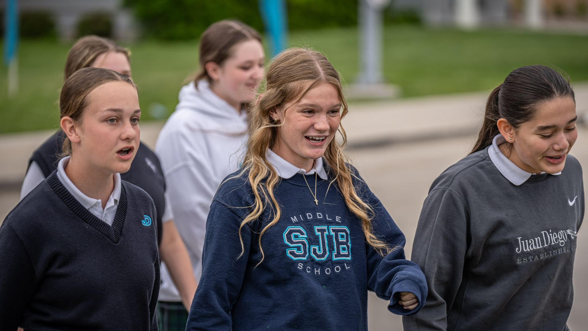Students socialising in the outdoor facilities at Saint John the Baptist Middle School.